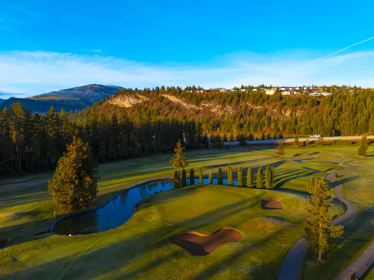 A green and pond at Shuswap Lake Golf Course below The Highlands, Blind Bay