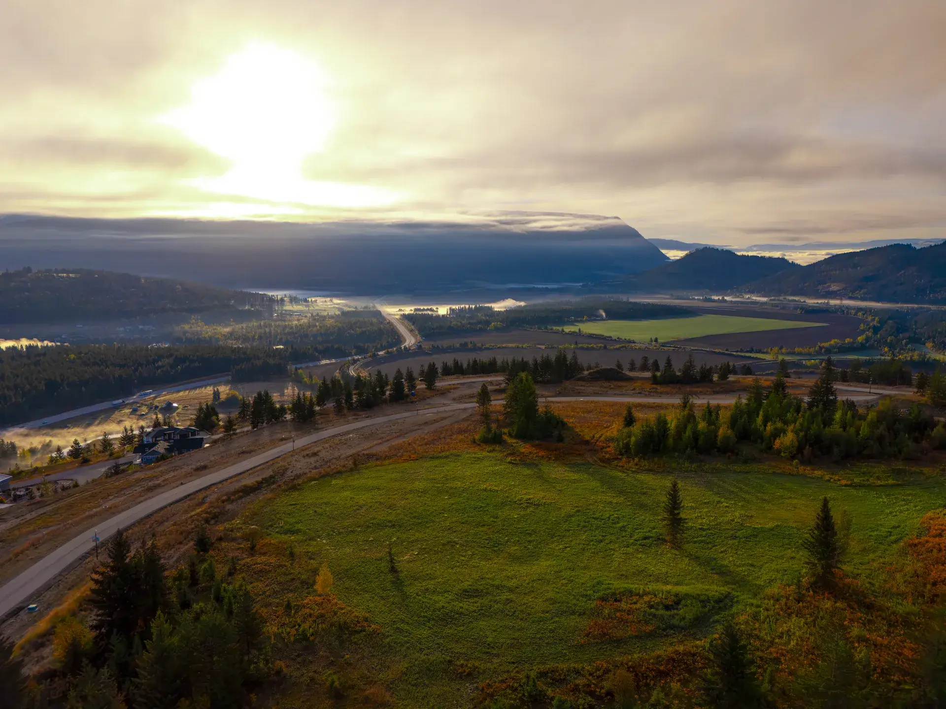 Sunrise over the west side of The Highlands Phase 3, Blind Bay: the park meadow and the valley below
